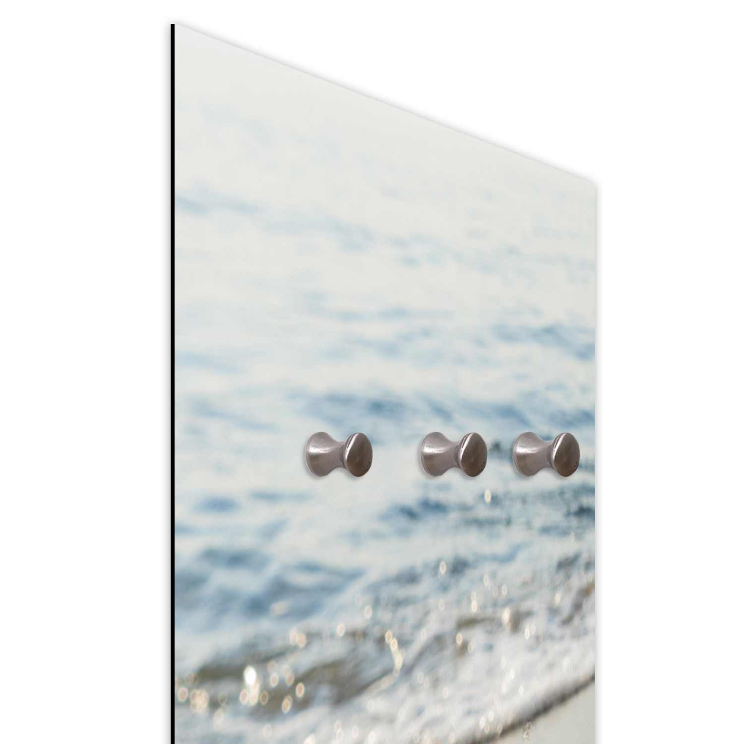 Coat rack made of fiberboard and satin paper with a drawing of a heart on the beach